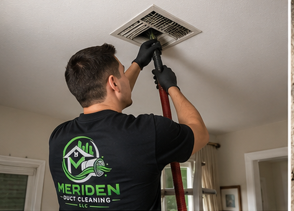Meriden Duct Cleaning LLC technician cleaning a ceiling air duct vent in a Meriden CT home